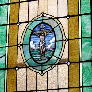 Stained glass of Jesus Christ on the Cross in Sacred Heart Catholic Church in Springfield MO